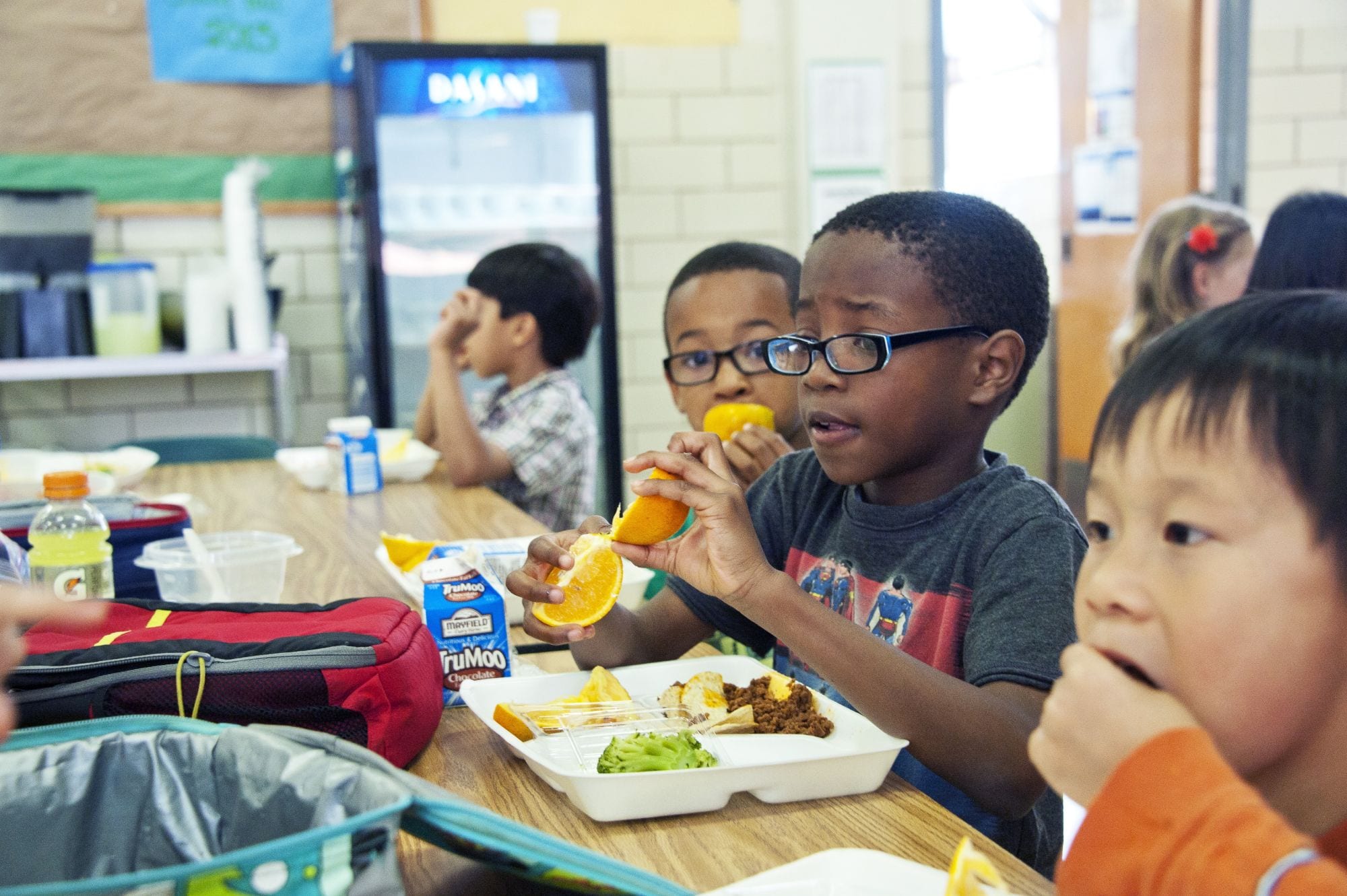 Kids eating school lunch - nut free school vs nut aware school